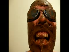 Pervert guy covers his face with a shit while eating it